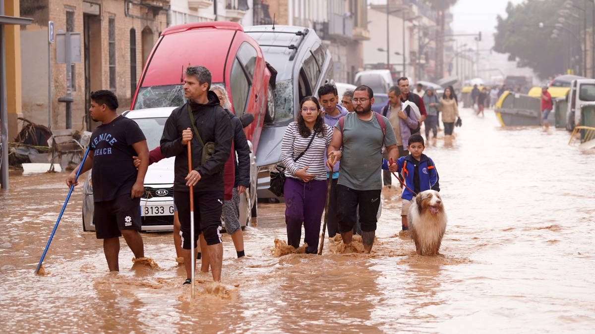 People successful flooded street