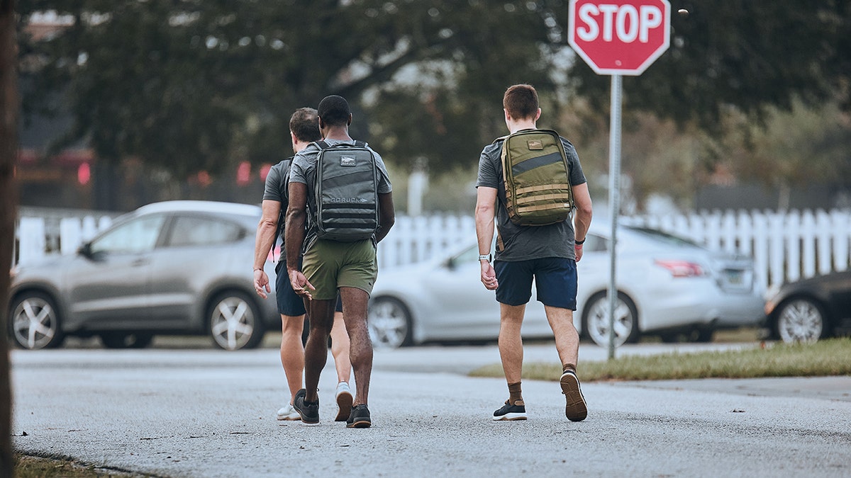 men running down the street