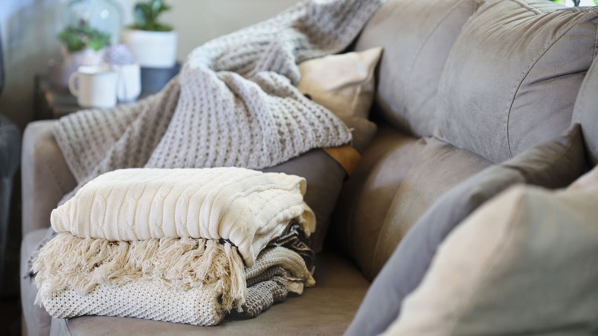 Stack of blankets on couch