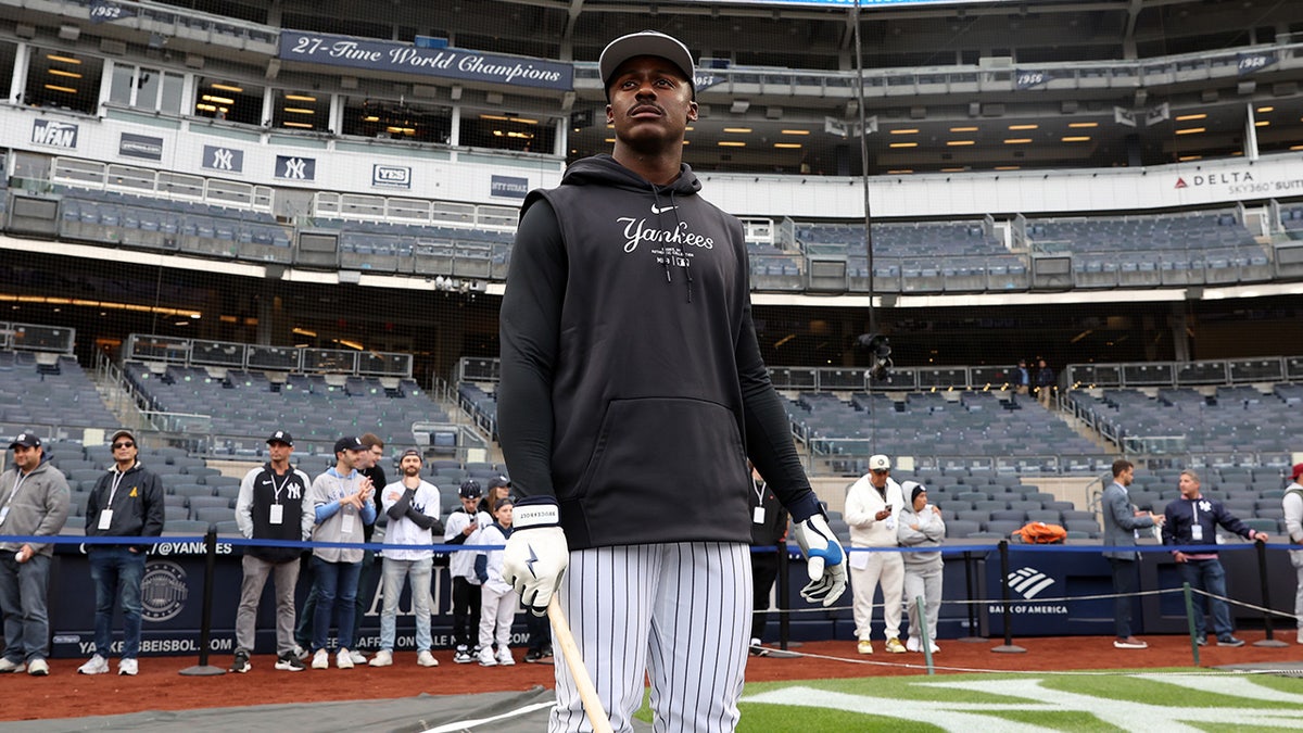 Taylor Trammell looks on