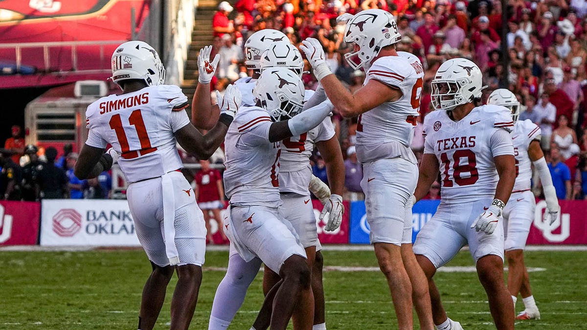 Texas football stars plant flag through Baker Mayfield jersey after win