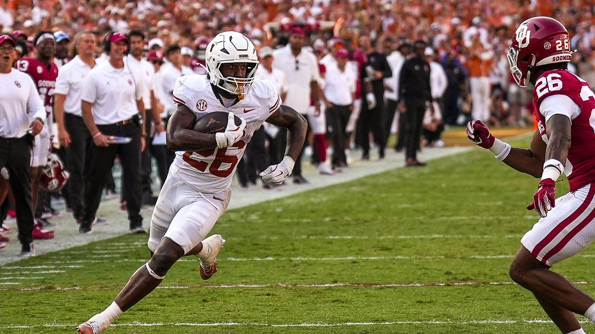 Texas Longhorns player runs with football