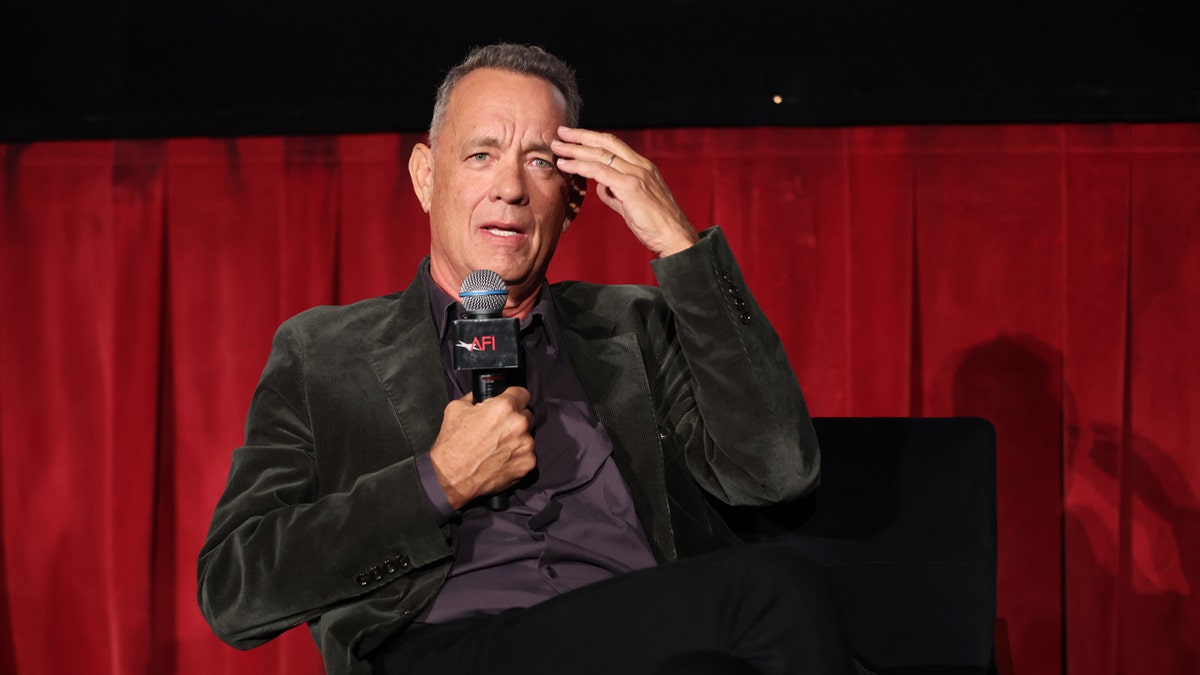 Tom Hanks sits on a panel