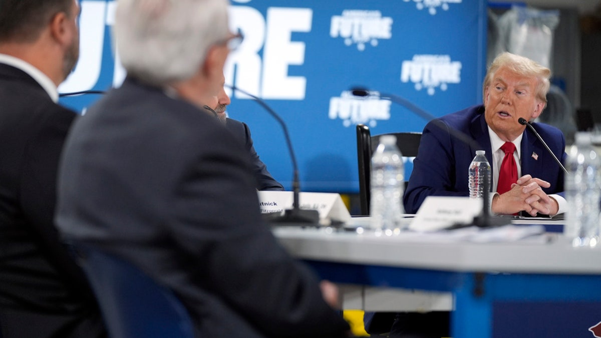 Former President Trump, the Republican presidential candidate, speaks at a roundtable in Auburn Hills, Michigan on Friday.