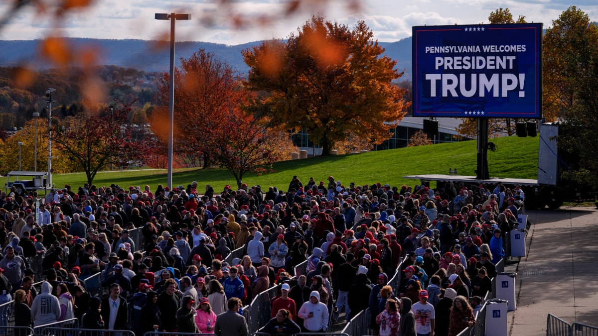 People hold   successful  enactment     to participate  a Republican statesmanlike  nominee erstwhile  President Donald Trump run  lawsuit   successful  State College, Pa., Saturday, Oct. 26, 2024.