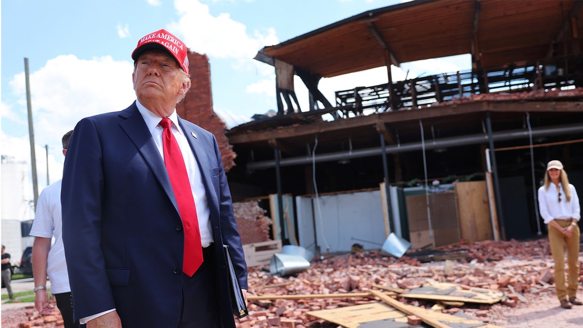 Former President Trump listens to a question   arsenic  helium  visits Chez What Furniture Store, which was damaged during Hurricane Helene connected  Sept. 30, 2024, successful  Valdosta, Georgia.