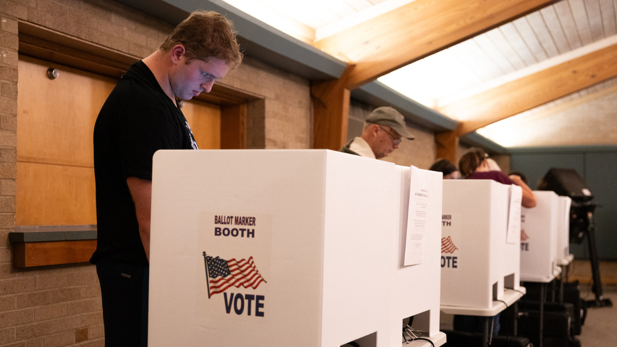 Voters fill out ballot papers