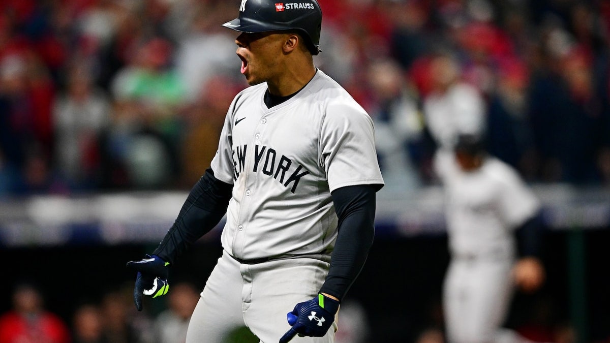 New York Yankees outfielder Juan Soto celebrates after hitting a three-run home run in the tenth inning against the Cleveland Guardians in Game Five of the ALCS for the 2024 MLB Playoffs at Progressive Field. 