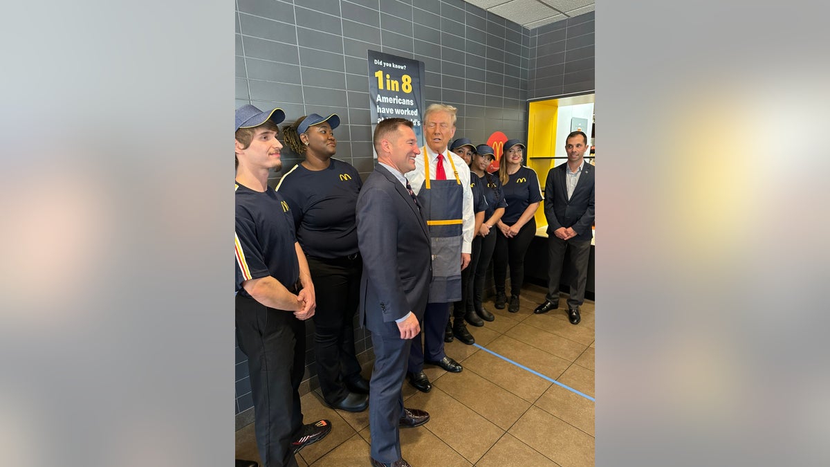 Former President Donald Trump, right, with Rep. Guy Reschenthaler, R-Pa., left, at McDonald's in Pennsylvania. 