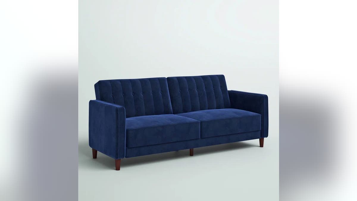 Elevate your surviving  abstraction  with this velvet convertible sofa.