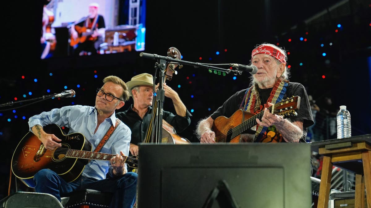 Musician Willie Nelson performs ahead of an event for Democratic presidential candidate Vice President Kamala Harris during a rally in Houston, Friday, Oct. 25, 2024. (AP Photo/Susan Walsh)