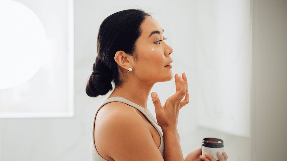 Anointing a woman's face