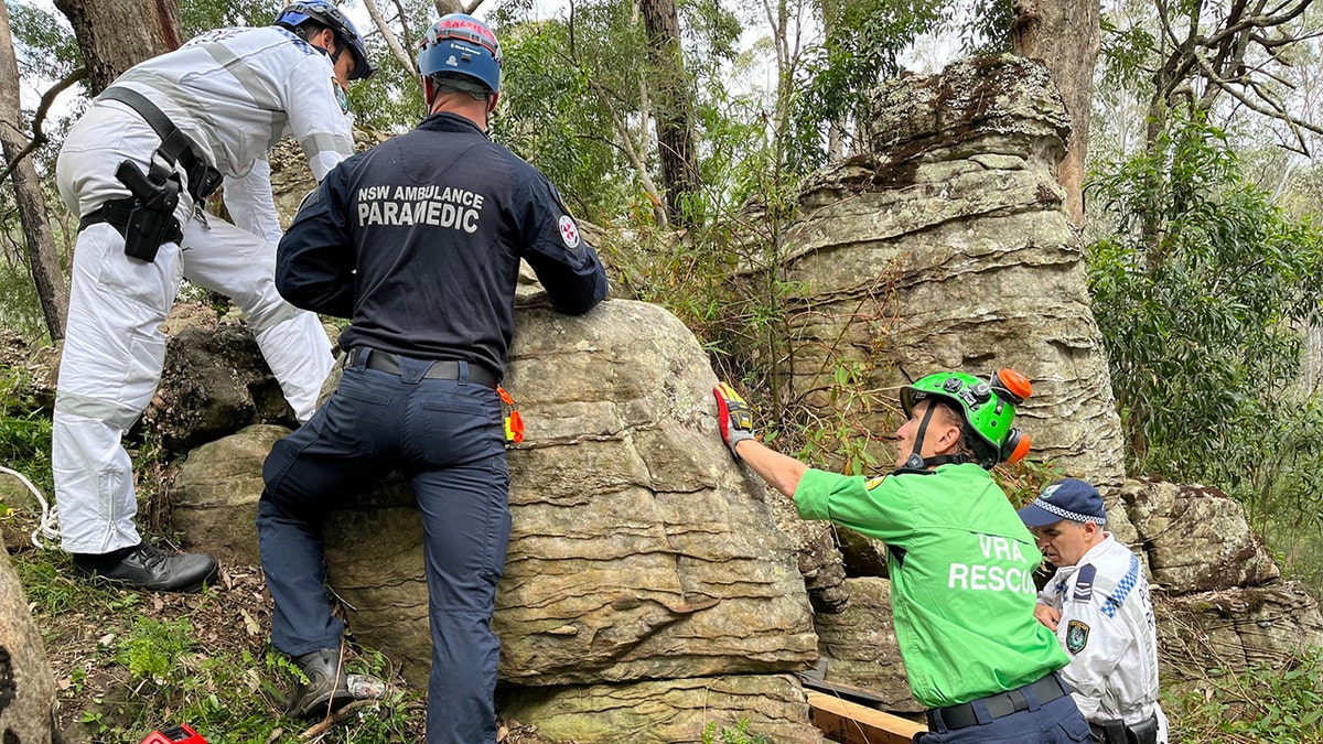 Woman becomes stuck upside down between boulders for 7 hours while trying to retrieve dropped phone  at george magazine