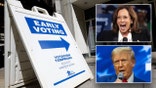 A polling place advertises early voting with Kamala Harris and Donald Trump inserts
