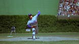 Fernando Valenzuela of the Los Angeles Dodgers pitches during a MLB game at Wrigley Field in Chicago, Illinois.