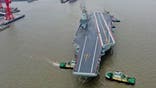 SHANGHAI, CHINA - MAY 01: The CNS Fujian, Chinas third aircraft carrier, begins its maiden sea trial on May 1, 2024 in Shanghai, China. The CNS Fujian, one of the most important pieces of military hardware China is working on, was officially unveiled in June 2022 in Shanghai as it was towed out of its dry dock at the China State Shipbuilding Corps Jiangnan Shipyard. (Photo by Pu Haiyang/VCG via Getty Images)