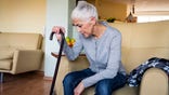 Senior woman with cane