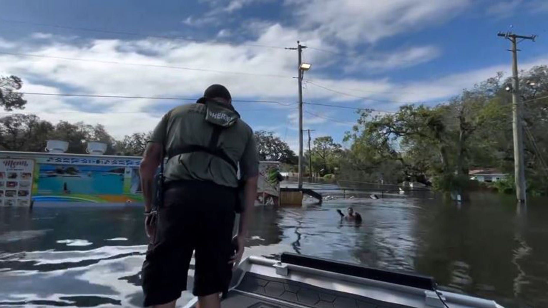 Teen Rescued from Storm-Flooded Waters on Fence Debris