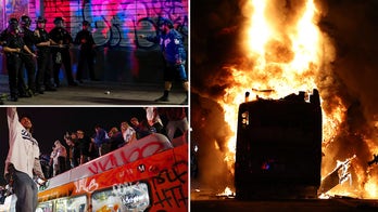 Dodgers celebrations erupt into chaos as ‘hostile’ crowd hurls projectiles at officers, sets city bus ablaze