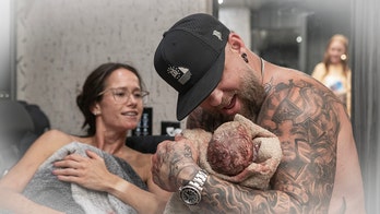 Country singer Brantley Gilbert abruptly pauses concert as wife gives birth on tour bus