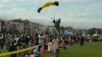 Navy parachutist crash-lands on mother and teenager during San Francisco performance: video