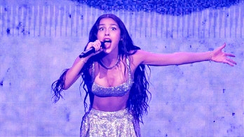 Pop star Olivia Rodrigo suffers onstage mishap as singer falls through trapdoor