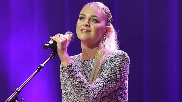 Kelsea Ballerini gets hit in the face with object thrown by fan