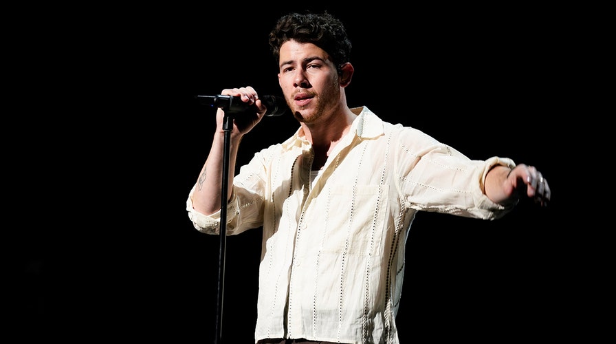 Nick Jonas runs off stage in Prague