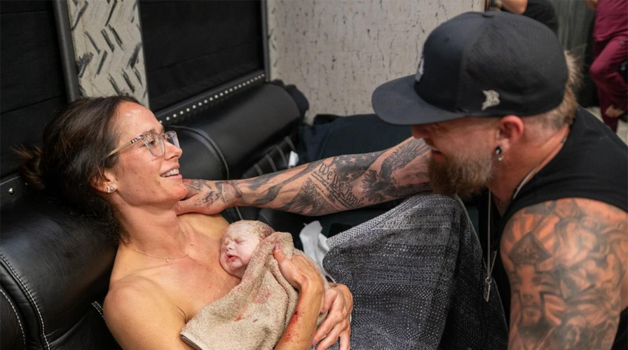 Brantley Gilbert paused show to help wife deliver their baby