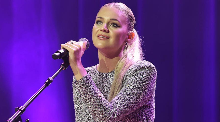 Kelsea Ballerini gets hit in the face with object thrown by fan