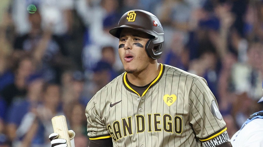 Dodgers' Dave Roberts thinks Manny Machado threw ball at him in