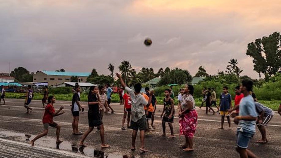 Tuvalu natives play   sports astatine  the airport.