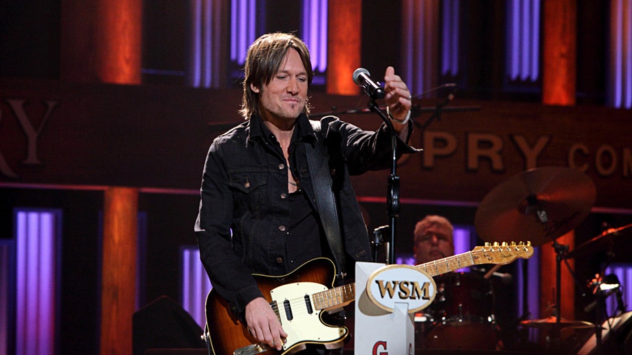 Keith Urban astatine  Grand ol Opry induction ceremonial  