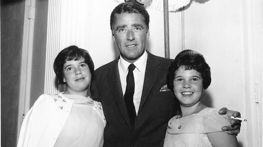 Peter Lawford and two young ladies