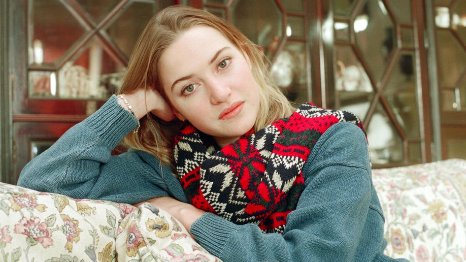 A young Kate Winslet posing at her house