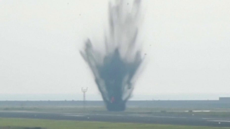 World War II-era bomb explodes at busy international airport, cratering taxiway thumbnail