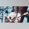 Phil Lesh playing the base while on stage with The Grateful Dead in 1982
