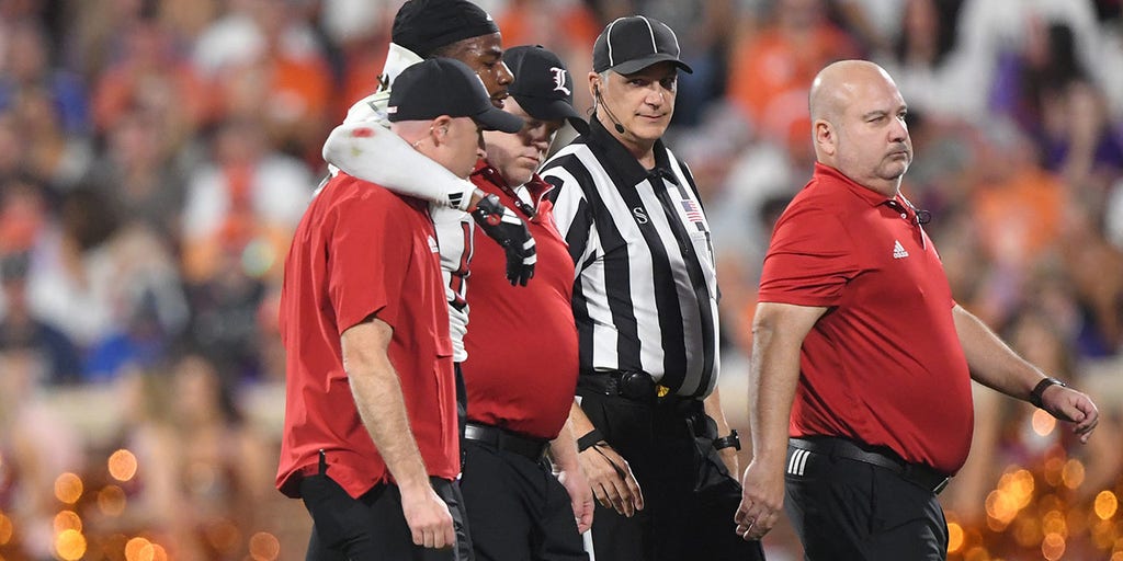 Louisville football player stretchered off, hospitalized after suffering injury in game