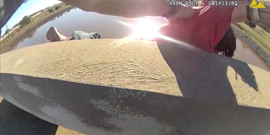 Sleeping man saved from rolling off bridge by police officer, Good Samaritan in dramatic video