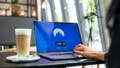 A woman using a VPN on her laptop - Fox News