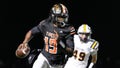 Belleville quarterback Bryce Underwood keeps the ball and runs against Saline during the second half of district final at Belleville High School in Belleville on Friday, Nov. 8, 2024. - Fox News