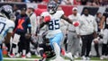 Tennessee Titans tight end Chig Okonkwo (85) runs past Houston Texans safety Eric Murray (23) after a catch to score a touchdown during the second half an NFL football game Sunday, Nov. 24, 2024, in Houston. - Fox News