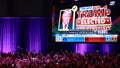 Supporters take photos as Fox News projects Republican presidential nominee, former U.S. President Donald Trump is elected president during an election night event at the Palm Beach Convention Center in West Palm Beach, Florida on November 6, 2024. - Fox News