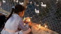 An Iraqi girl lights a candle outside of the Imam al-Mahdi shrine during a ceremony on the 15th of the Islamic month of Shaaban marking his birth, two weeks ahead of the holy month of Ramadan, in Iraq's central city of Karbala on February 25, 2024. - Fox News