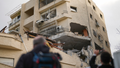 Journalists take pictures of a building hit direct by a rocket fired from Lebanon in Haifa, Israel, Sunday Nov. 24, 2024. - Fox News