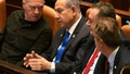 Israeli Prime Minister Benjamin Netanyahu, center, speaks to Defense Minister Yoav Gallant, left, at the opening of the 25th Knesset session marking the anniversary of the "Iron Swords" war, in Jerusalem, Monday, Oct. 28, 2024. - Fox News