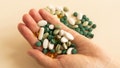 hand holding miscellaneous pills - Fox News