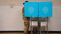 A member of the U.S. military casts their ballot during the midterm runoff elections at Psalmond Road Recreation Center in Columbus, Georgia, U.S. December 6, 2022. REUTERS/Cheney Orr - Fox News