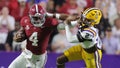 Jalen Milroe #4 of the Alabama Crimson Tide runs with the ball as Jardin Gilbert #2 of the LSU Tigers defends during the first half at Tiger Stadium on November 09, 2024 in Baton Rouge, Louisiana. - Fox News