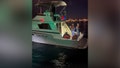 The U.S. Coast Guard apprehended 21 migrants from a fishing vessel on Thursday, nearly a mile off the coast of Newport Beach, California. - Fox News